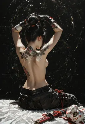 Tattooed Warrior Resting With Her Blade