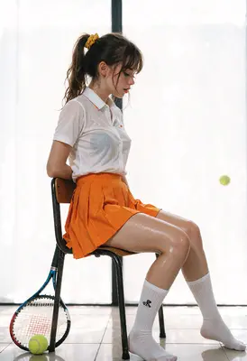 Wet Tennis Player Resting After Match