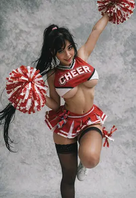 Energetic Cheerleader in Red Uniform