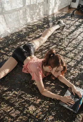 Stretching Girl Using Her Laptop