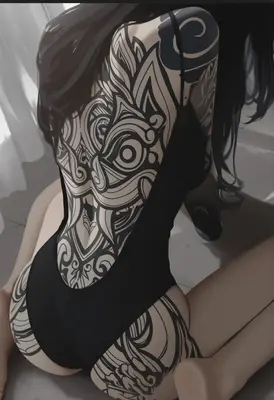 Intricate Back Tattoo in Black Bodysuit