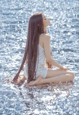 Serene Maiden Amidst Shimmering Waters