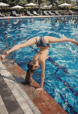 Athletic Girl Doing Handstand By Pool